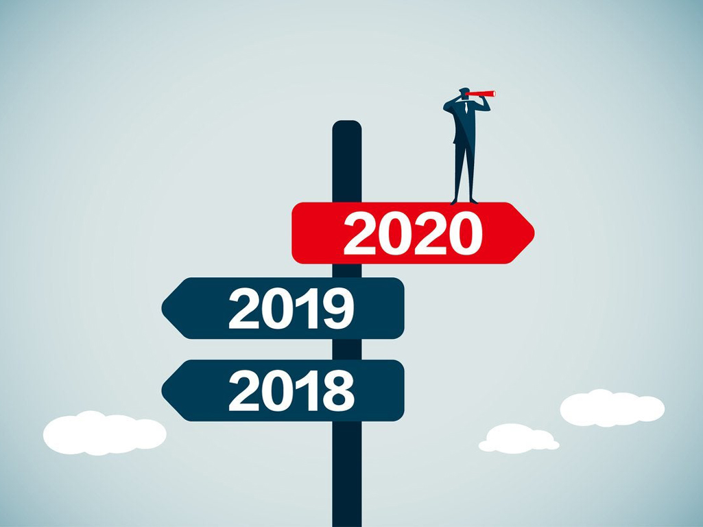 Signpost with the year 2020 and a man with a telescope