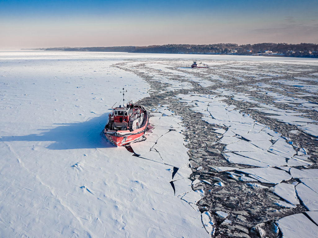 Ice breaker ship blazing new path through ice