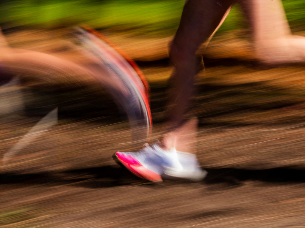 blurred feet running in a race
